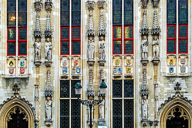 Architectural facade detail at one old building placed in Burg square, Bruges, Belgium.