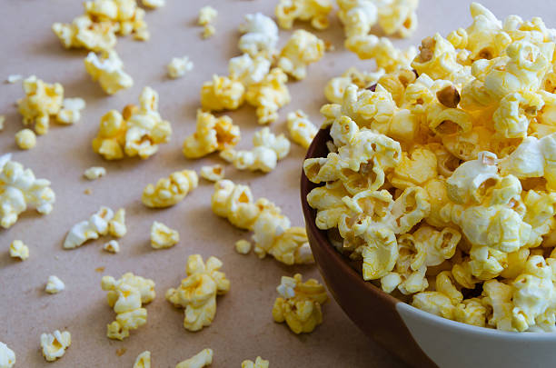istock Caramel Popcorn Spread Out On The Floor. 495980502
