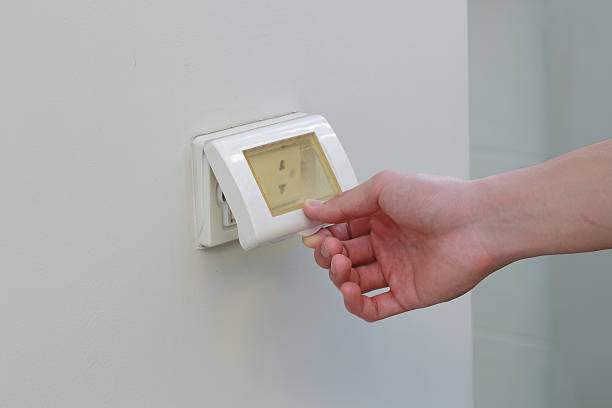 istock open the Waterproof electric plug by hand 495981000
