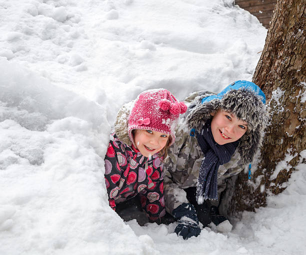 istock Children playing in a snow cave 495982274