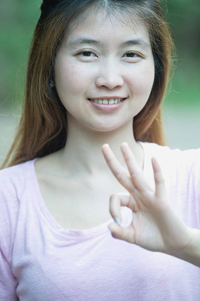 istock asia young cute woman showing 
