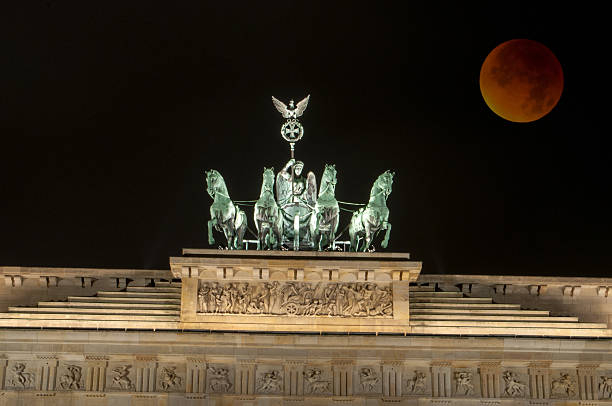 istock Brandenburg Gate with Bloody Moon, Berlin, Germany 495983202