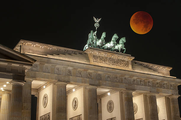 istock Brandenburg Gate with Bloody Moon, Berlin, Germany 495983238