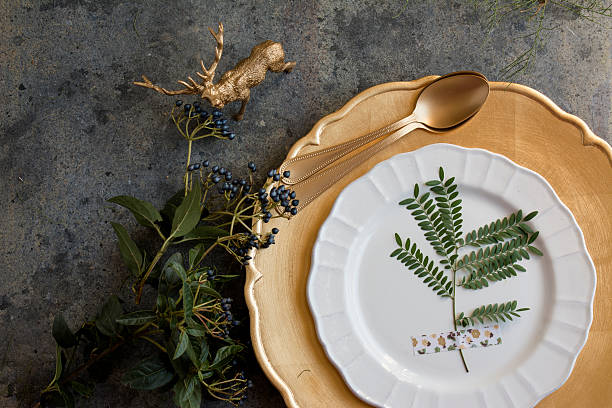 Holiday Gold place setting, napkin brown plaid, on grunge backgr