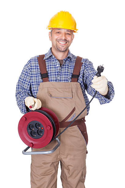 istock Happy Electrician Holding Wire Plug 495985634