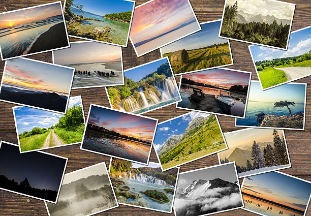istock Collage of landscapes on wooden table 495985682