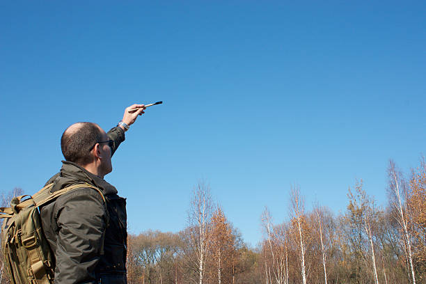 istock man writes a brush against a blue sky 495987882