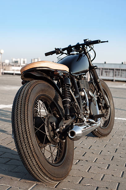 istock Vintage motorcycle in parking lot during sunset 495988322