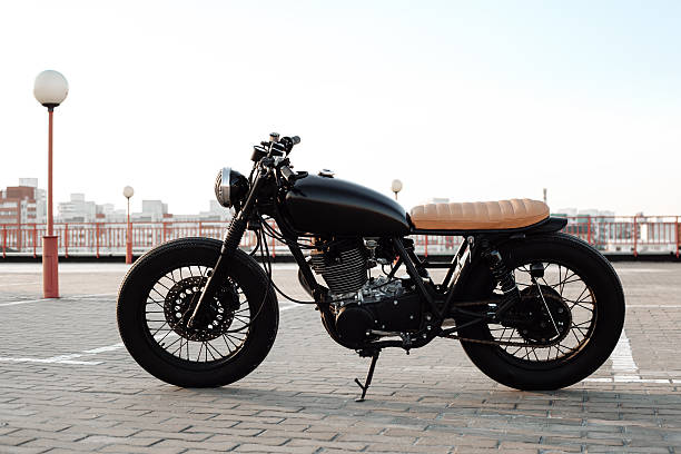 istock Vintage motorcycle in parking lot during sunset 495988414