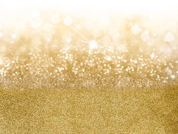 золотой рождественский фон - glitter defocused illuminated textured effect стоковые фото и изображения