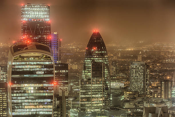 Londons Cityscape at Night A view over London's skyline at night. london gherkin at night stock pictures, royalty-free photos & images