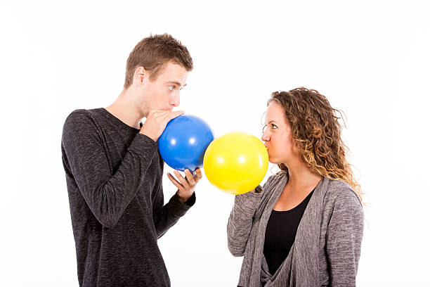 istock young couple with ballons 496026910