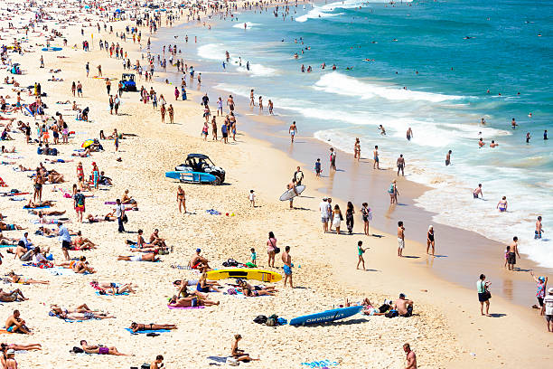 Crowded beach in hot summer day, Bondi beach Sydney Australia Crowded beach in hot summer day, Bondi beach Sydney Australia, full frame horizontal composition bondi beach photos stock pictures, royalty-free photos & images