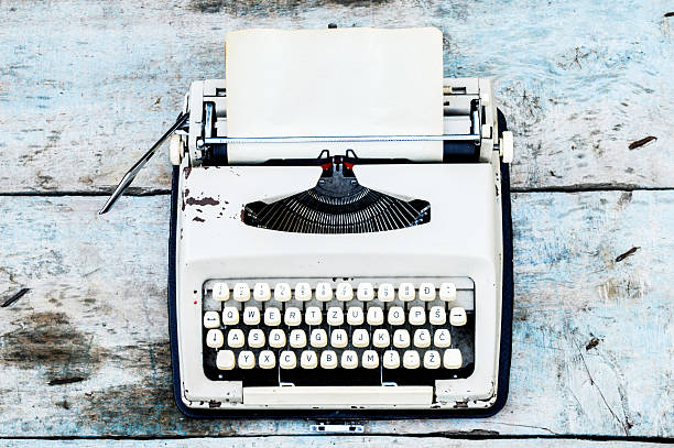 istock Retro typewriter on a wooden background 496030500