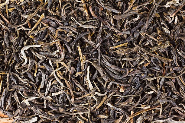 istock Green tea dry leaves. Macro, background 496030580