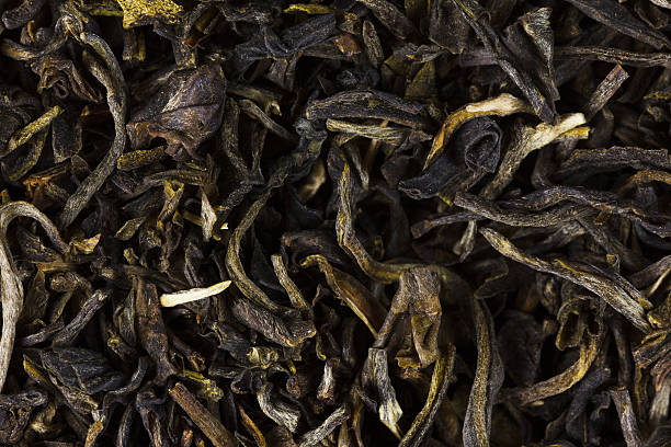 istock Green tea dry leaves. Macro, background 496030644