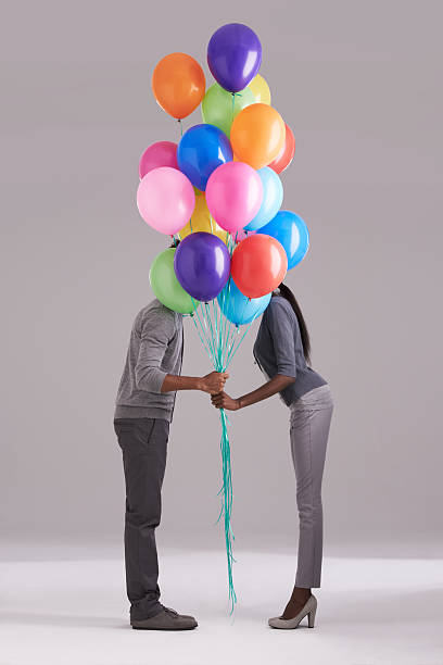 istock Stealing a kiss behind the balloons 496030869