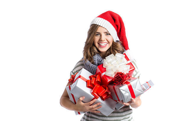 fille de noël, tenant beaucoup de cadeaux. - women red isolated on white contemporary photos et images de collection