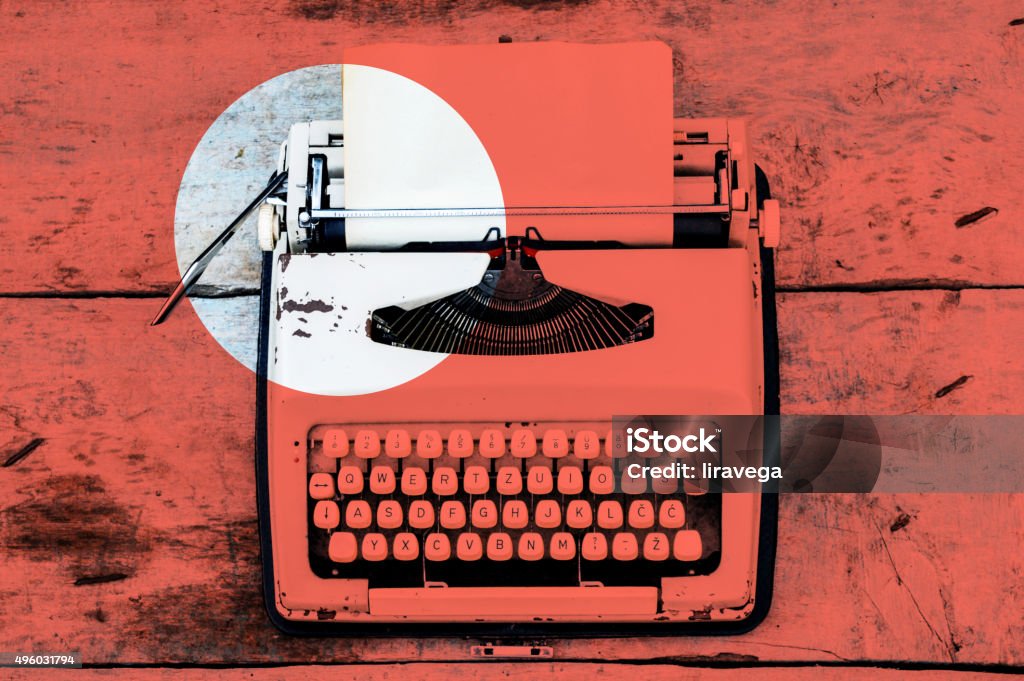 Retro typewriter on a wooden background Typewriter Stock Photo