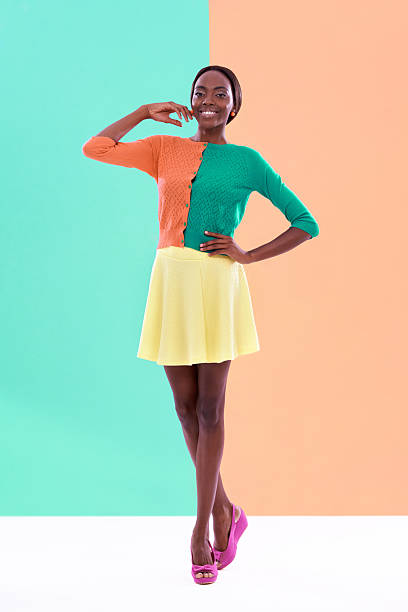 Studio portrait of an attractive woman posing in front of a colorful backgroundhttp://195.154.178.81/DATA/i_collage/pi/shoots/783402.jpg