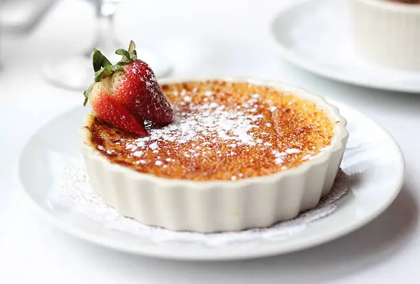 A plate of delicious dessert creme brulee