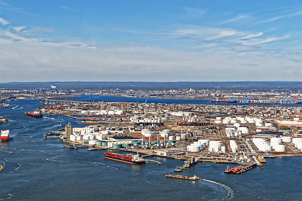 View of Port Newark and MAERSK shipping containers, Bayonne, NJ View of Port Newark and the MAERSK shipping containers in Bayonne, New Jersey. The area is known for oil storage and international shipping jersey england stock pictures, royalty-free photos & images