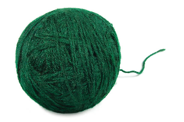 istock Natural green fine wool ball thread, isolated clew macro closeup 496034169