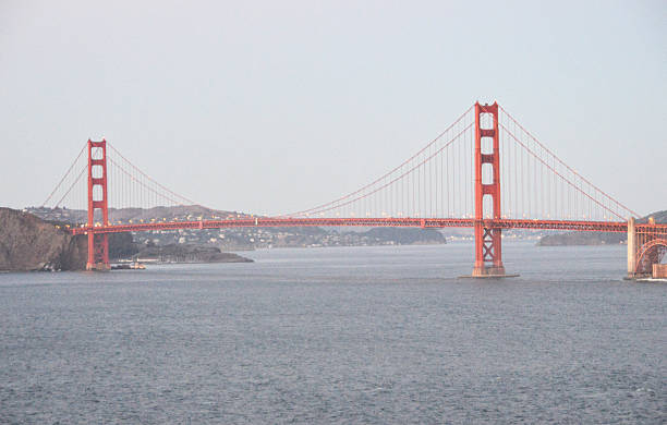 мост золотые ворота-закате - golden gate bridge car san francisco bay san francisco county стоковые фото и изображения