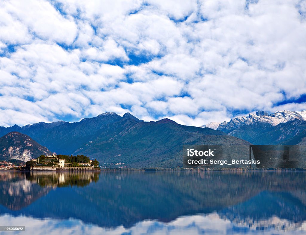 View over Lake Maggiore and Alps mountains View over Lake Maggiore and Alps mountains with the Isola Bella Island  in Northern Italy. 2015 Stock Photo