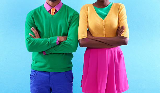 Style with a colorful attitude Cropped studio shot of a two stylishly dressed people standing with their arms crossedhttp://195.154.178.81/DATA/i_collage/pi/shoots/783402.jpg man and woman differences stock pictures, royalty-free photos & images