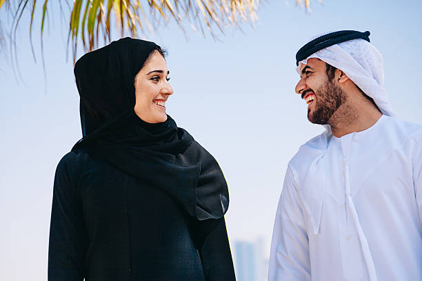 istock Happy Arab Couple enjoying at beach 496037046