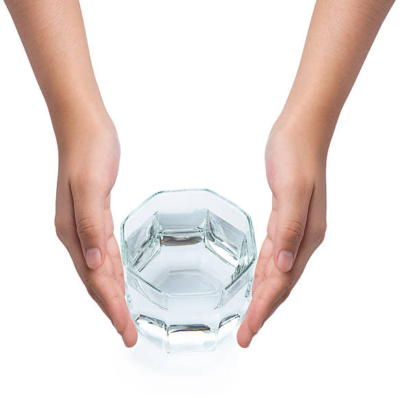 istock Female hand holding drinking water on white background 496037048