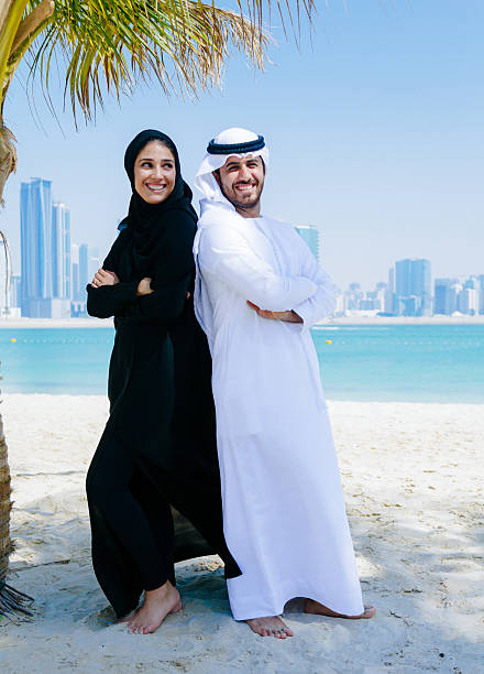 istock Happy Arab Couple enjoying at beach 496037116