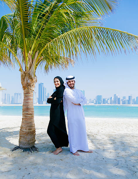 istock Happy Arab Couple enjoying at beach 496037158