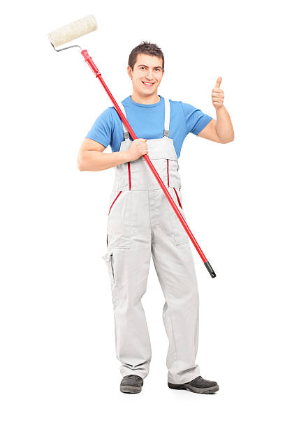 istock Male painter holding a roller and giving thumb up 496037189