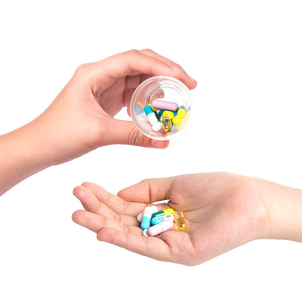 istock Drug capsules and pills in hand 496037934