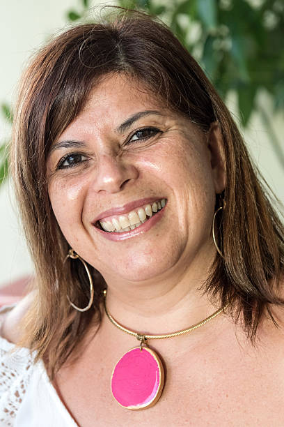 istock Smiling Mature Hispanic Woman 496039058
