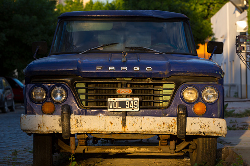 Buenos Aires, Argentina - November 18, 2014: Front view of vintage blue Fargo car in the street of Buenos Aires with sunset light, Argentina 2014
