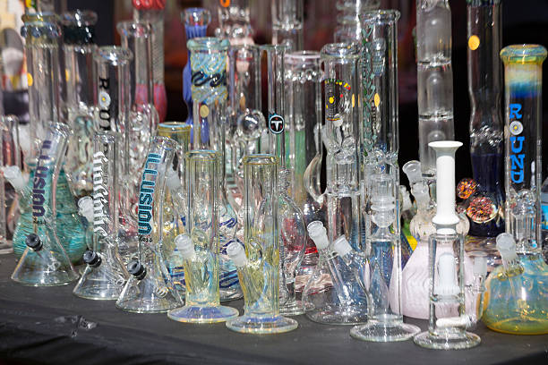 Seattle Hempfest Marijuana Festival 2015 Bongs Seattle, Washington, USA - August 16, 2015: A large display of bongs and other paraphernalia for use with marijuana are for sale at Hempfest, Seattle's annual event celebrating the legalization of marijuana. bong stock pictures, royalty-free photos & images