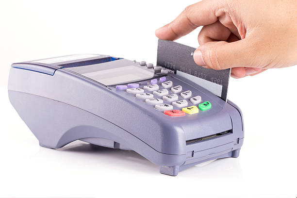istock Hand Swiping Credit card on Credit card Machine 496062018