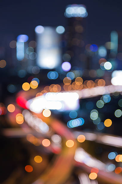 istock Night blurred bokeh light of city road interchange 496064046