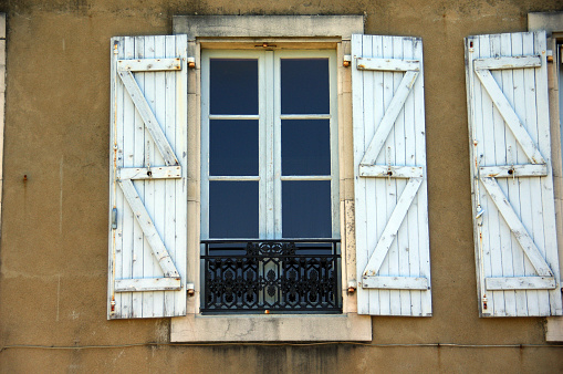 Old window in a French house on a summer day