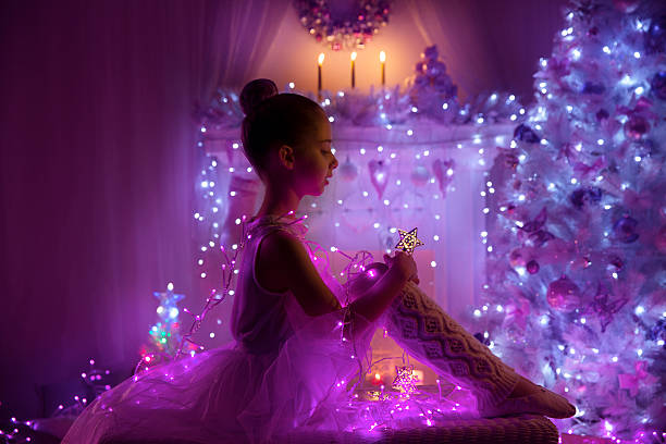 Girl Child Christmas Tree Lights, Cute Kid, Fairy Holiday Night Girl Child as Angel with Fairy Star, Christmas Tree Lights, Cute Kid in Holiday Night, pink purple color dark pink dress stock pictures, royalty-free photos & images