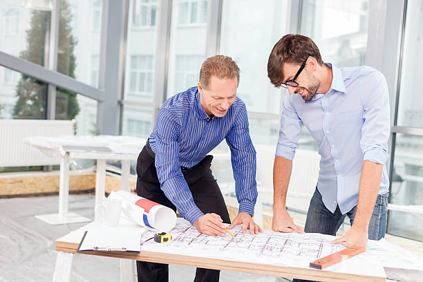 istock Professional male engineers are discussing new project 496071340