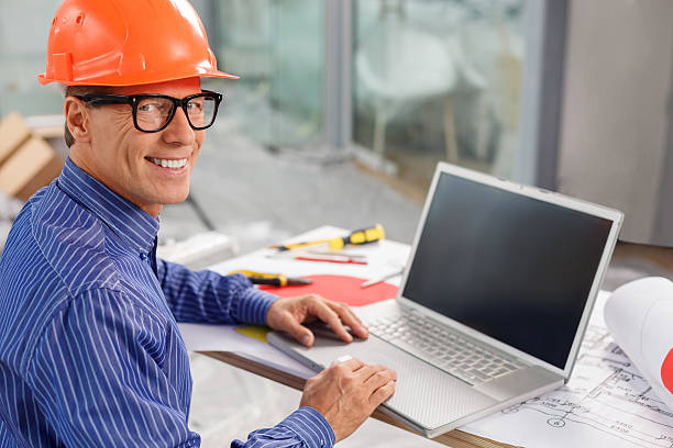 istock Skillful mature male engineer is working in office 496071654
