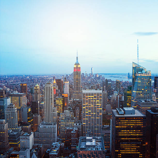 istock Manhattan cityscape with Empire State Building at night 496073208