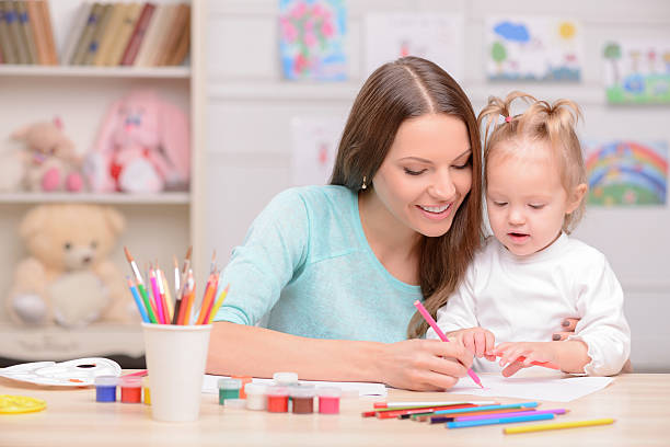 istock Beautiful friendly family is painting with joy 496073732
