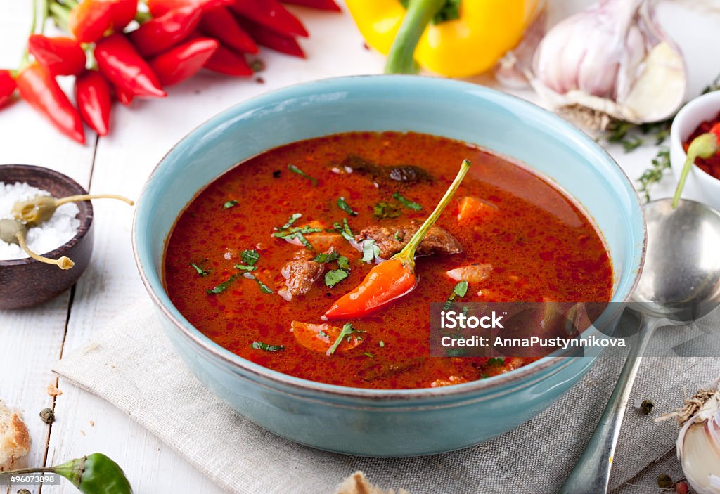 Goulash, beef, tomato, pepper, chili, smoked paprika soup.  Traditional Hungarian dish. Homemade Tomato Soup for Lunch Carrot Stock Photo