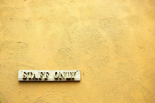 istock Staff Only signboard on the orange wall 496074750