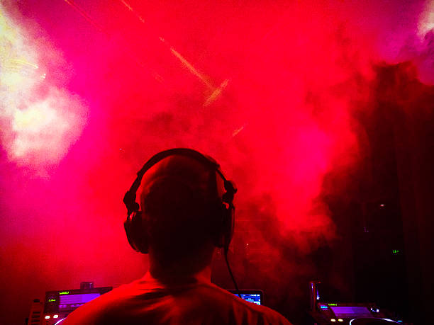 DJ mixing beats in nightclub